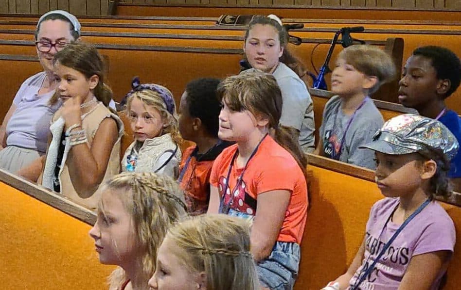 Kids and teachers together in the pews