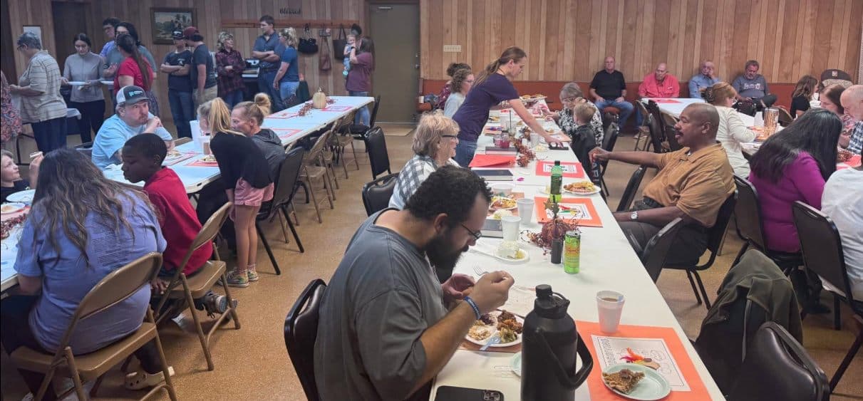 The whole church family sharing a meal in the fellowship hall